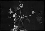 Medium chaplin playing cello