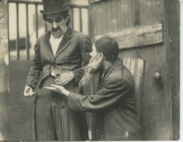 Charlie Chaplin as Professor Bosco & Loyal Underwood as a dosshouse manager, 1919